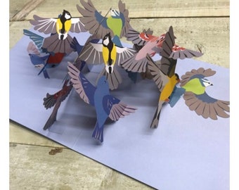 Pop-upkaart - ontwerp met vliegende paarse vogels van 2ToTango