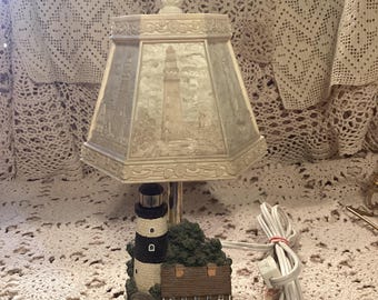 Vintage lighthouse with keeper’s quarters lamp with molded six panel shade