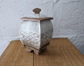 Square pottery jar with fish scale design