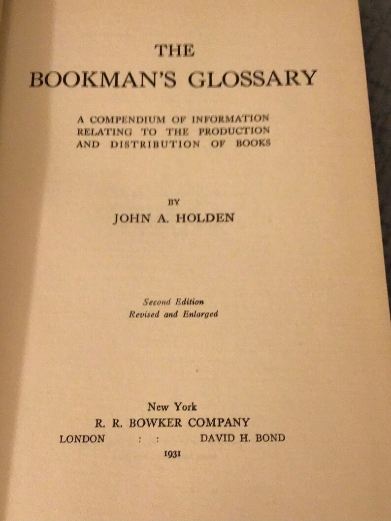 May include: The Bookman's Glossary: A Compendium of Information Relating to the Production and Distribution of Books by John A. Holden. Second Edition, Revised and Enlarged. New York: R. R. Bowker Company, London: David H. Bond, 1931.