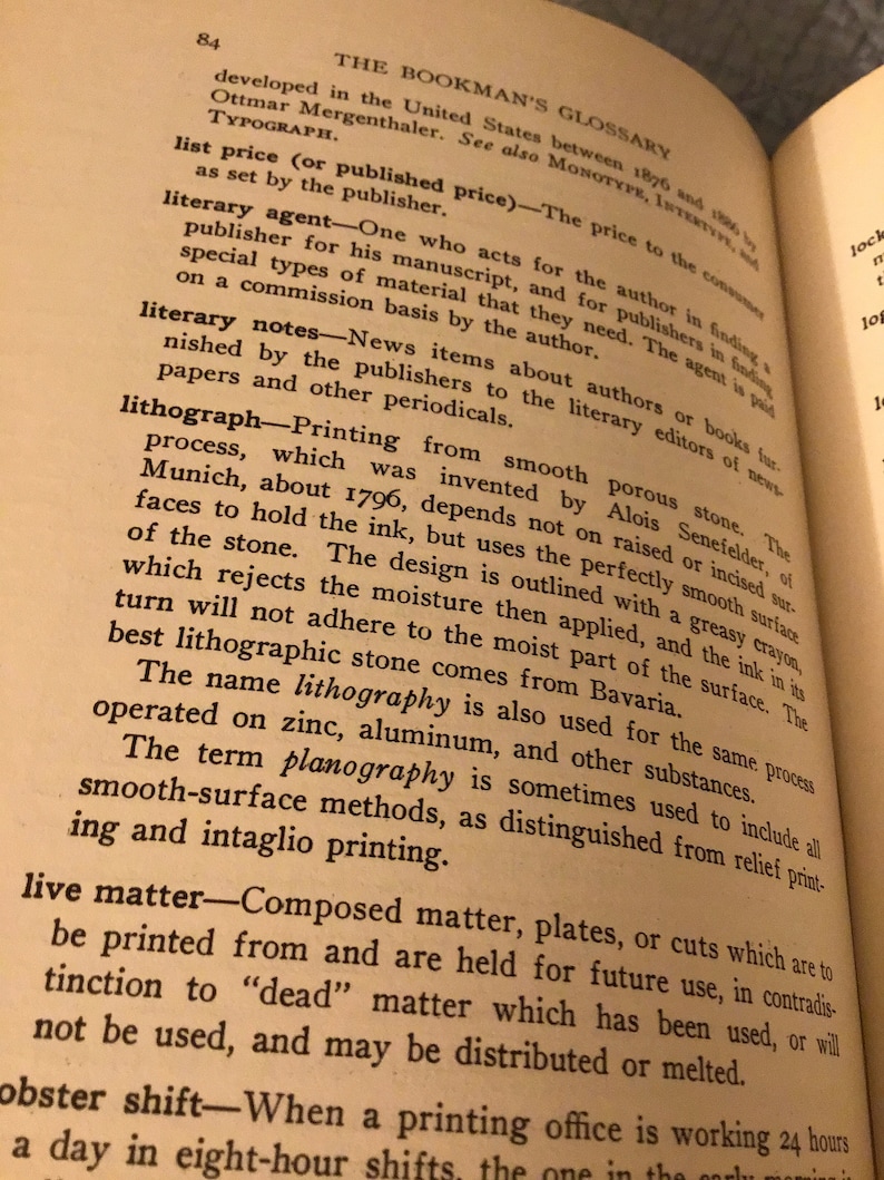 May include: A page from a book titled "The Bookman's Glossary" with text about the history of typography and the process of lithography. The text describes the process of lithography, which was invented by Alois Senefelder in Munich, Germany, around 1796.