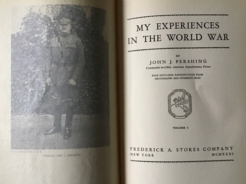 May include: A black and white photo of a man in a military uniform. The photo is from the book "My Experiences in the World War" by John J. Pershing, Commander-in-Chief, American Expeditionary Forces. The book was published in 1931 by Frederick A. Stokes Company.