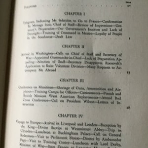 May include: A black and white book with the title "CONTENTS" and the text "VOLUME I" on the cover. The book has a table of contents with chapter titles and page numbers. The chapters are titled "Chapter I", "Chapter II", "Chapter III", and "Chapter IV".