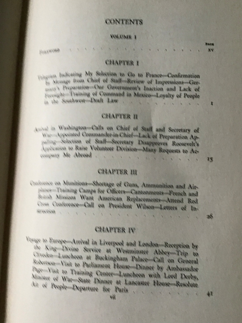 May include: A black and white book with the title "CONTENTS" and the text "VOLUME I" on the cover. The book has a table of contents with chapter titles and page numbers. The chapters are titled "Chapter I", "Chapter II", "Chapter III", and "Chapter IV".
