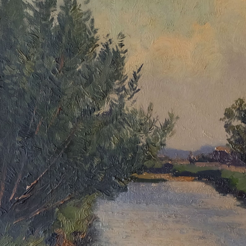 May include: A painting of a river scene with a large green tree on the left side of the image. The river is light blue and the sky is a pale yellow.