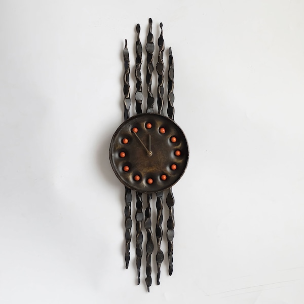 Brutalist 1970's cast iron wall clock with a Kienzle Germany movement.  Great appearance and is a great eye-catcher in a home.