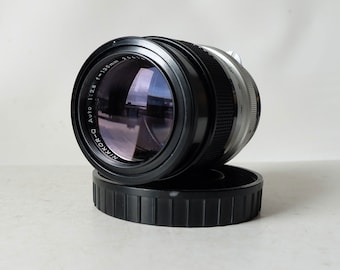 Nikon Nikkor-Q Auto 1:2.8 f= 135mm F-mount, Non Ai, obiettivo Manuel Focus per fotocamere Nikon F vintage. Con filtro originale Nikon L39 da 52mm.