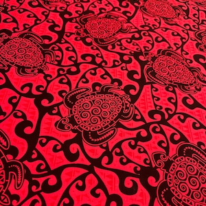 May include: Red fabric with a black repeating pattern of stylized sea turtles and swirling vines. The turtles have intricate designs on their shells.