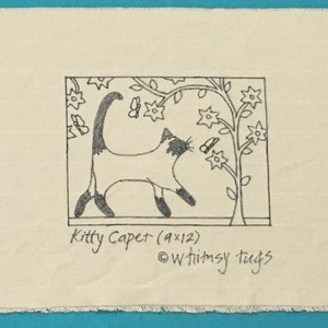 May include: Black and white line drawing of a cat with a butterfly on a branch of a tree with flowers. The drawing is on a white fabric background with the text "Kitty Caper (9x12) © Whimsy Tags".