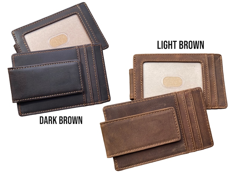 May include: Two leather wallets with a money clip. The wallet on the left is dark brown and the wallet on the right is light brown. Both wallets have a card slot and a money clip.