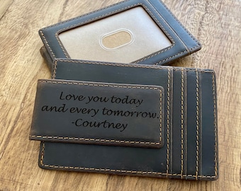 May include: A brown leather wallet with a money clip and multiple card slots. The wallet has an engraved message that reads "Love you today and every tomorrow. -Courtney."