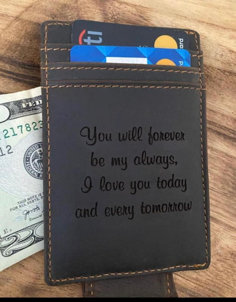 May include: A brown leather wallet with a card slot and an engraved message that reads "You will forever be my always, I love you today and every tomorrow".