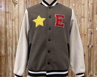 May include: A gray varsity jacket with white sleeves and a red "E" and yellow star on the front.