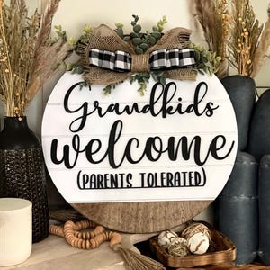 Funny Grandkids Welcome Door Hanger: Tolerated Parents Gift