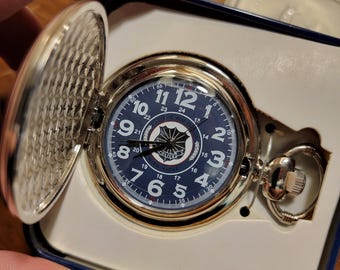 POLICE  Emblem  POCKET WATCH by Avon - New in Tin Box (2006)