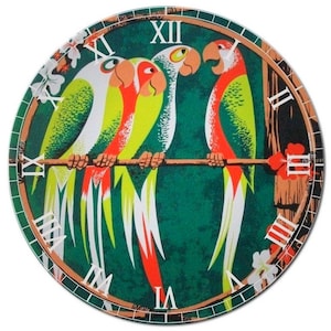 May include: A round wall clock featuring a vibrant illustration of four parrots perched on a branch. The parrots have green, red, yellow, and white plumage. The clock face is dark green with Roman numeral hour markers and a brown border.