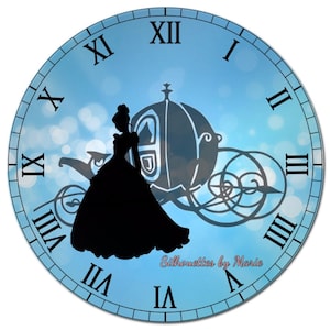 May include: A blue clock face with Roman numerals and a silhouette of Cinderella in her ball gown and carriage. The text "Silhouettes by Marie" is at the bottom of the clock face.