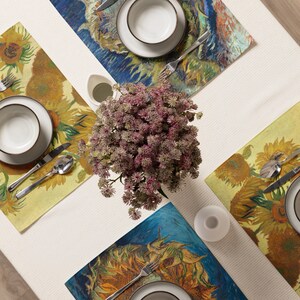 This stunning set of 4 placemats feature the infamous Sunflower paintings by Vincent Van Gogh. The most famous mostly yellow painting, and two with blue backgrounds. The contrasting yellows and blues will brighten up any table!