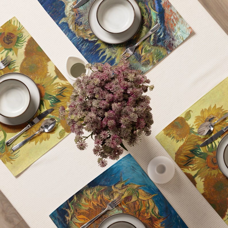 This stunning set of 4 placemats feature the infamous Sunflower paintings by Vincent Van Gogh. The most famous mostly yellow painting, and two with blue backgrounds. The contrasting yellows and blues will brighten up any table!