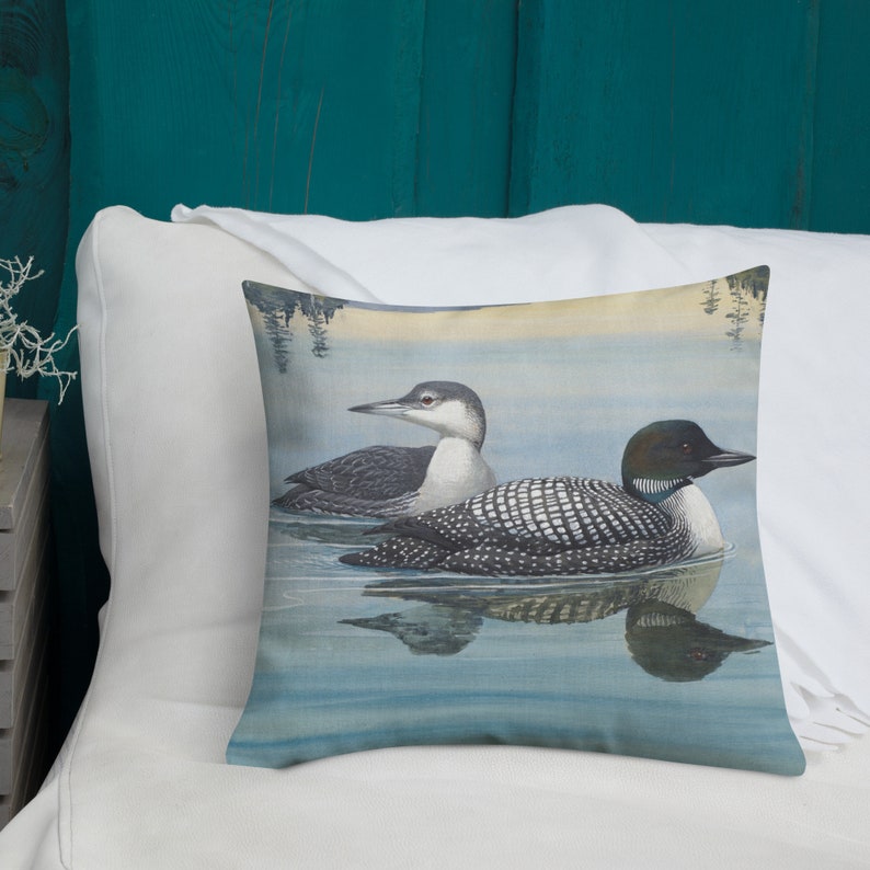 This beautiful pillow comes in two sizes, 18x18 or 22x22 inch and features a painting of an adult and immature common loon. The amazing state bird of Minnesota! The perfect addition to any living room or cabin!