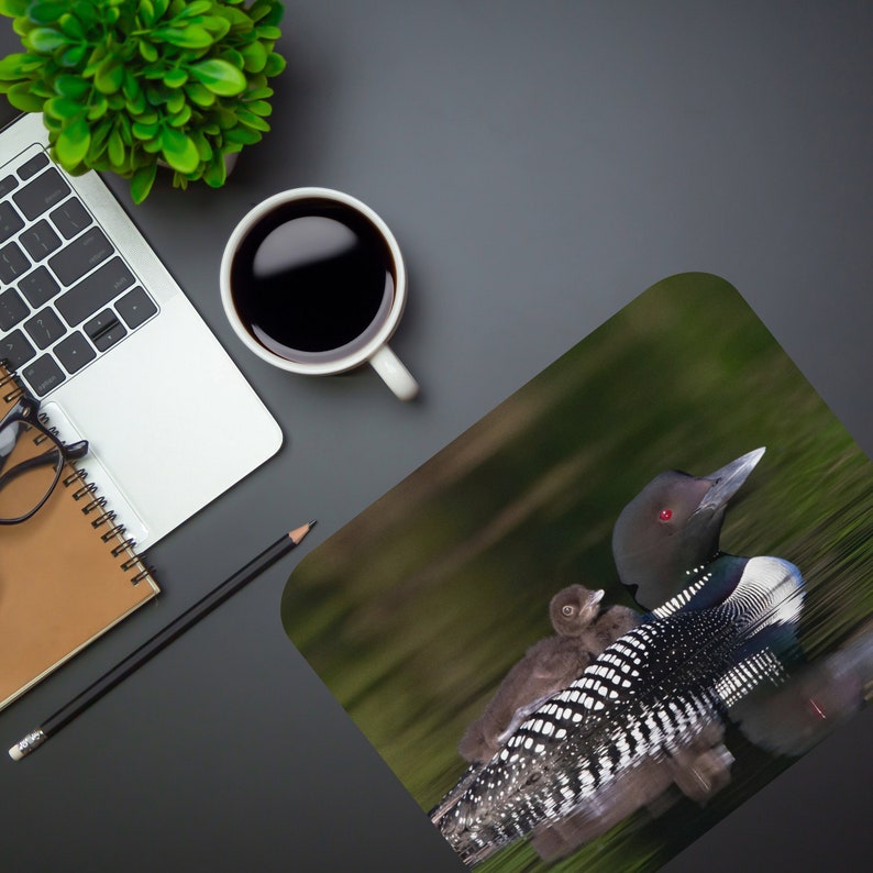 This beautiful mouse pad features a loon "mama" with her baby. We are proud to have the common loon as our Minnesota state bird!