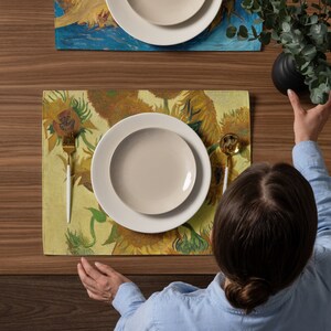 This stunning set of 4 placemats feature the infamous Sunflower paintings by Vincent Van Gogh. The most famous mostly yellow painting, and two with blue backgrounds. The contrasting yellows and blues will brighten up any table!