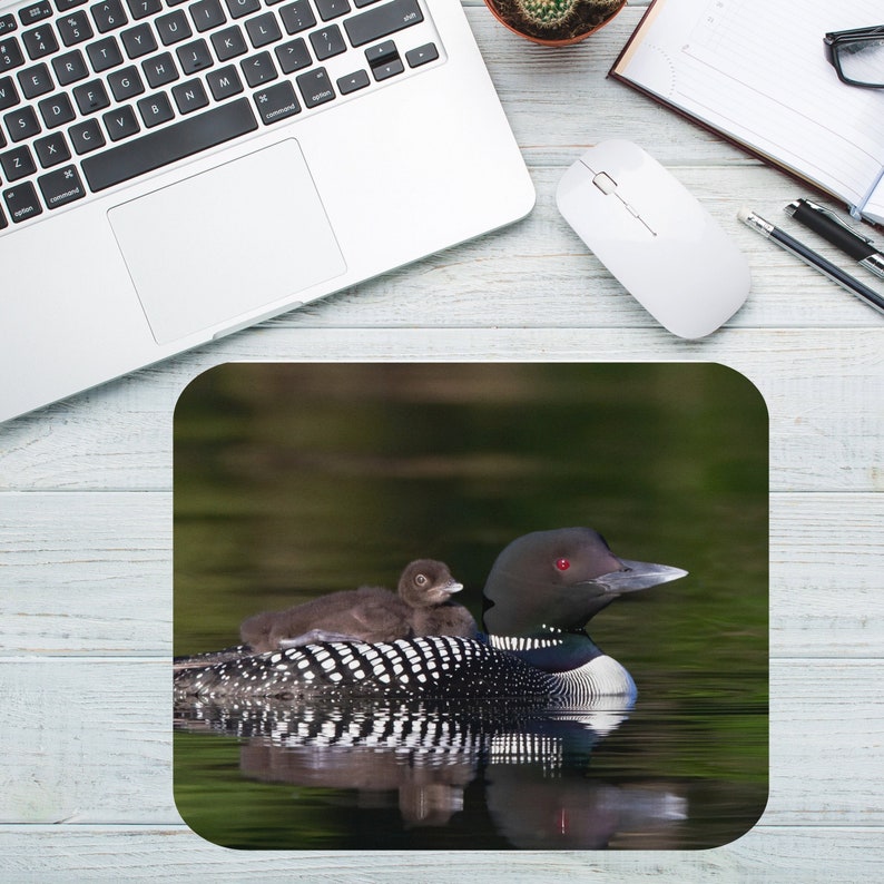 This beautiful mouse pad features a loon "mama" with her baby. We are proud to have the common loon as our Minnesota state bird!