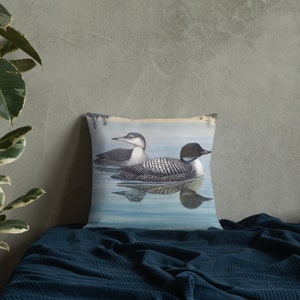 This beautiful pillow comes in two sizes, 18x18 or 22x22 inch and features a painting of an adult and immature common loon. The amazing state bird of Minnesota! The perfect addition to any living room or cabin!