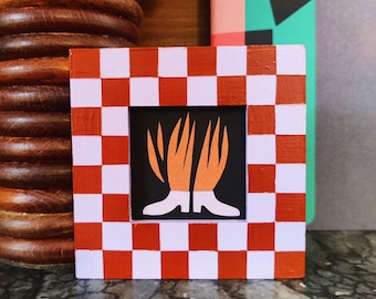 Flaming boots - framed cut-out paper illustration