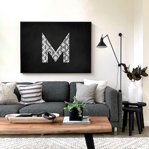 Latvian alphabet letters in traditional Latvian ornament pattern - black and white chalkboard family name first letter Baltic style