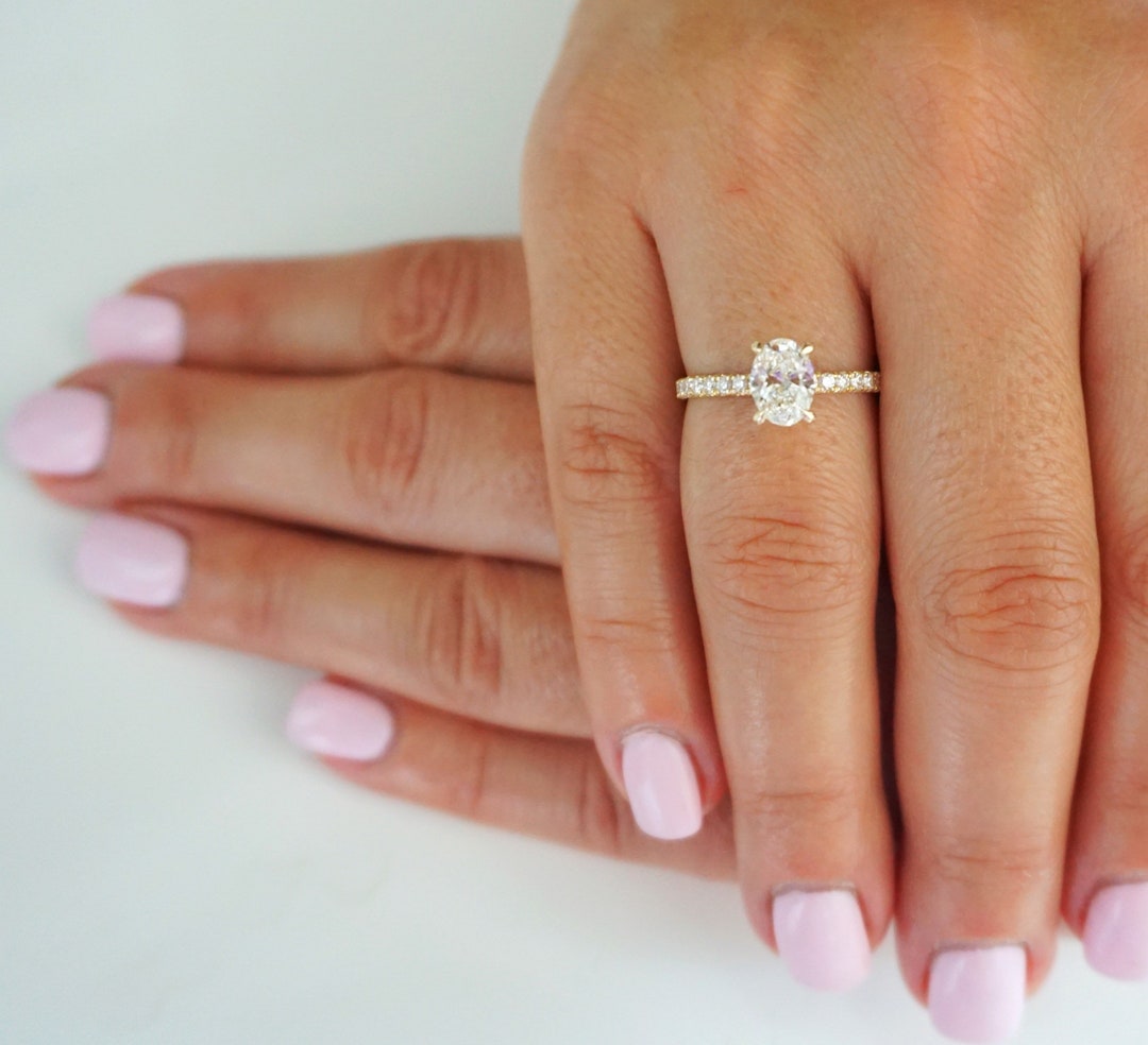 1.5 carat oval diamond sale ring on hand