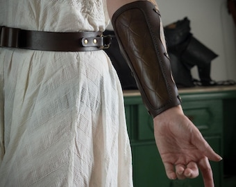 Leather archery arm guard with dragon scale pattern