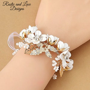 White Bracelet Corsage with White Flowers, Pearls, Rhinestones, Gold Leaves & Wire, and Sheer White Ribbon Ties (1 1/4"x5 1/2" inches)