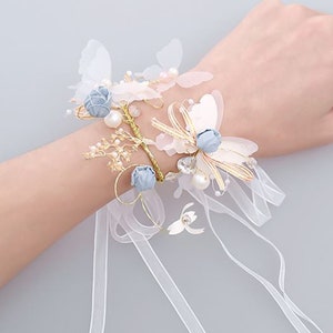 Dainty Butterfly Wrist Bracelet Corsage with Dusty Blue Flowers Gold Wire Ribbon Flowers Pearls and Rhinestones