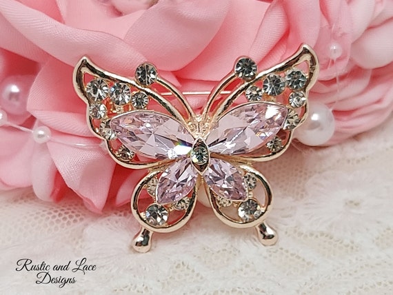 Pink butterfly best sale brooch