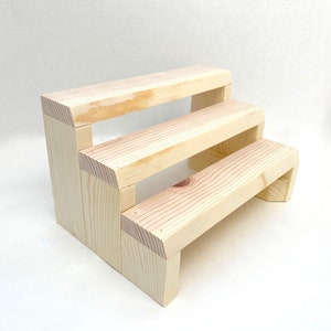 Solid pine wood tiered spice rack display stand for countertop.