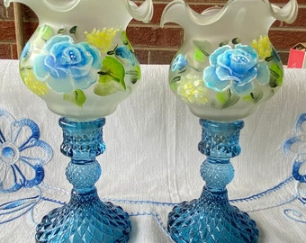 Hand painted 2 frosted glass votive cup holder with blue roses in blue candlestick holders. Great Mother’s Day gift, all occasion gift