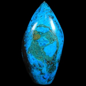 May include: A polished, teardrop-shaped gemstone in a vibrant blue, with teal and dark green patches. The stone has a smooth, glossy surface and a unique, natural pattern. The background is solid black.