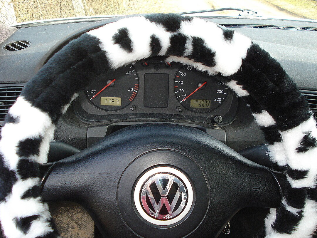 Fuzzy cow print steering wheel cover discount
