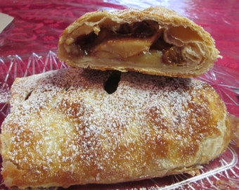 Apple / Apple Raisin/ or Apple Pear Raisin Strudel sprinkled with powder sugar or drizzled with icing