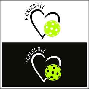 May include: A black and white graphic design of a heart with the word "Pickleball" written around it. A green pickleball is inside the heart.