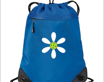 May include: Blue drawstring bag with a white daisy and a green pickleball in the center. The bag has a mesh top and a zippered pocket.