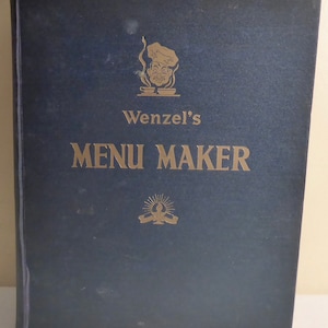May include: A blue hardcover book with gold lettering. The title is "Wenzel's Menu Maker". There is a cartoon chef with a pot and a steaming pot on the cover.