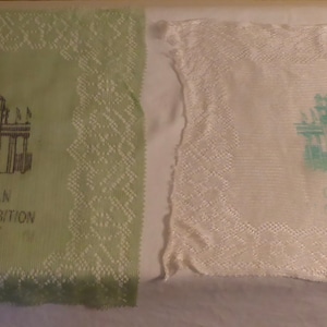 May include: Two vintage lace handkerchiefs with a green and white design. Both handkerchiefs feature an image of a building with the text "Canadian National Exhibition" printed on the green handkerchief and "Canadian National Exhibition" printed on the white handkerchief.