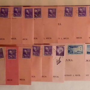 May include: A collection of 36 vintage envelopes with stamps featuring a variety of designs, including a building, a bird, and a person. The envelopes are all in good condition and have been carefully preserved. The envelopes are arranged in rows and columns on a white surface.