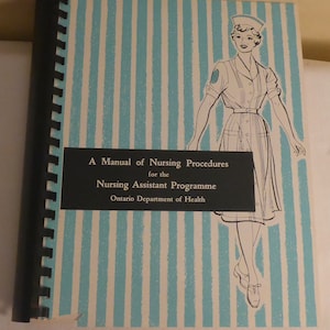 May include: A blue and white striped cover of a book titled "A Manual of Nursing Procedures for the Nursing Assistant Programme Ontario Department of Health". The cover features a black and white illustration of a nurse in a white uniform and cap.