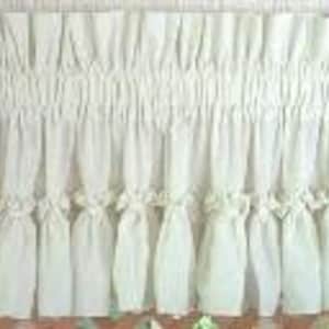 May include: A white ruffled valance with a gathered, gathered, and ruffled design. The valance is made of a lightweight fabric and has a simple, elegant look.