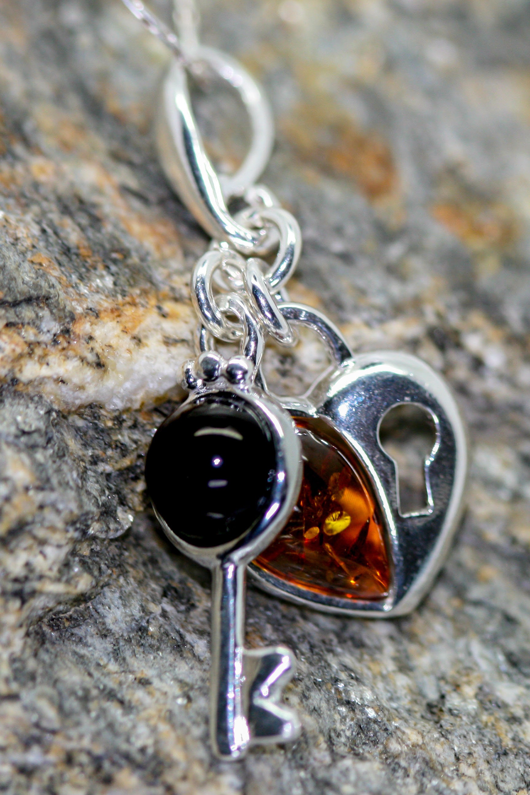 Heart shaped pendant. Whitby Jet and Amber pendant. Sterling Silver