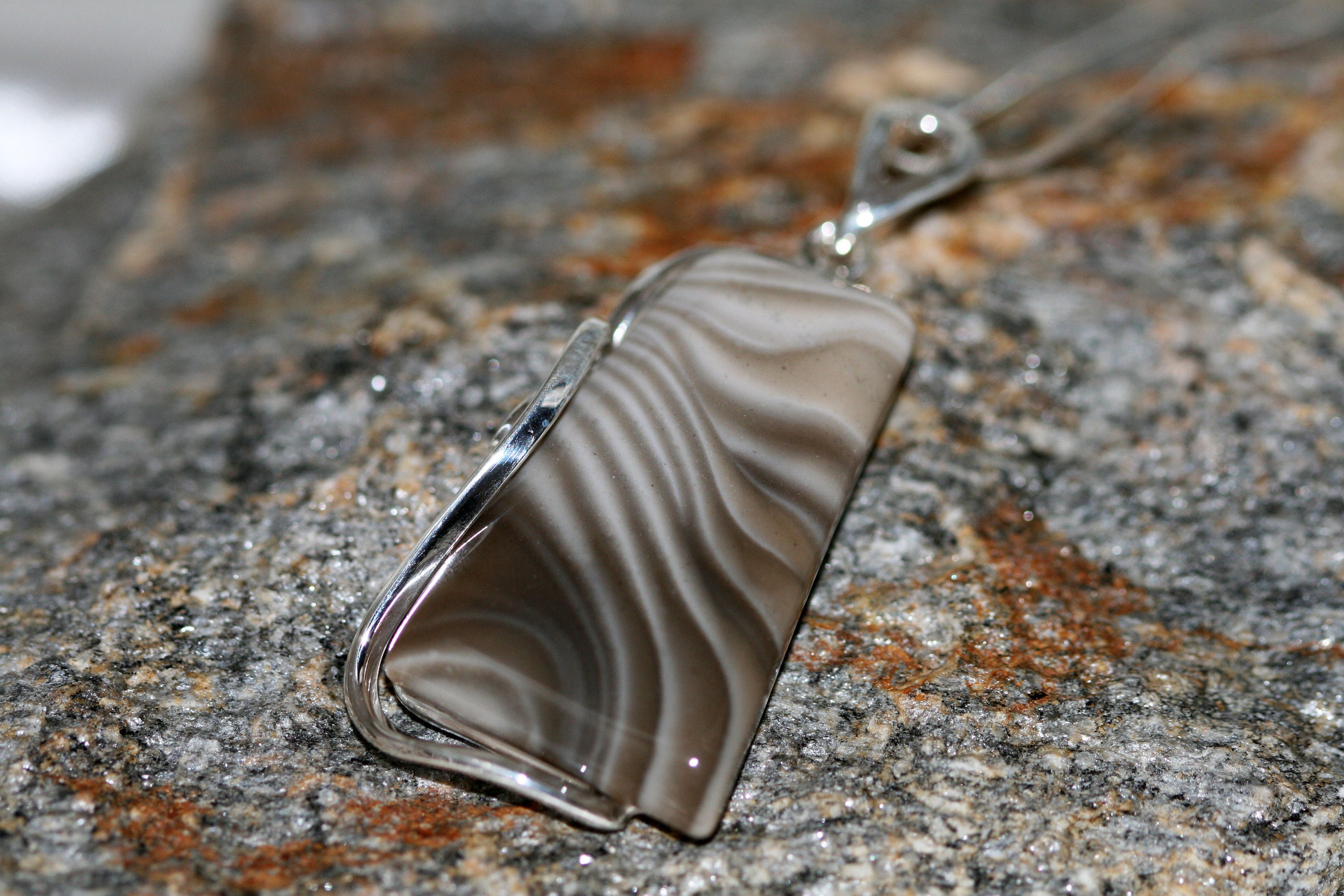 Striped Flint Pendant fitted in Sterling Silver setting. Perfect gift