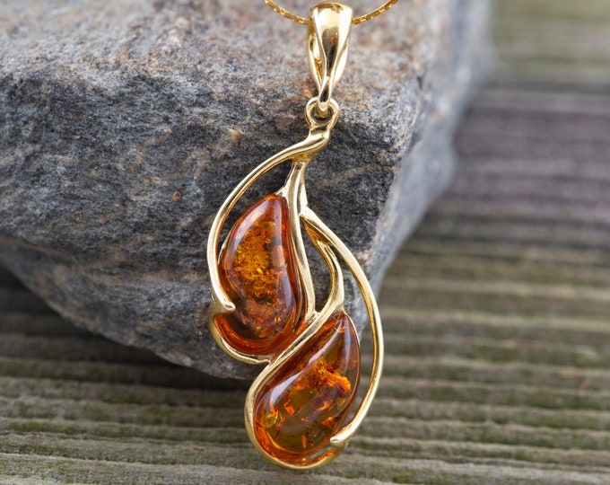 Amber & Gold. Amber pendant. Golden pendant. Elegant pendant. Contemporary pendant. Designer jewelry. Artistic pendant. Unique jewelry.